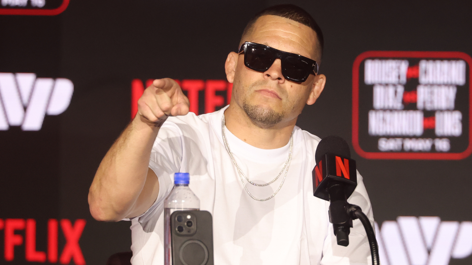Nate Diaz comically put Ariel Helwani in a rear naked choke during ceremonial weigh-ins for his MMA return – but the veteran reporter did not tap
